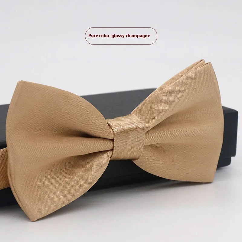 Solid colour flat head bow tie for formal wear in multiple colours including black, red, and blue.