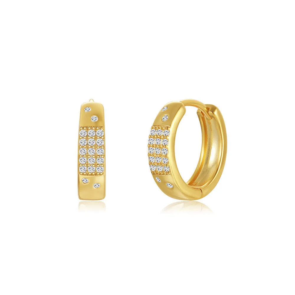Golden brass earclip earrings with geometric shapes and round elements