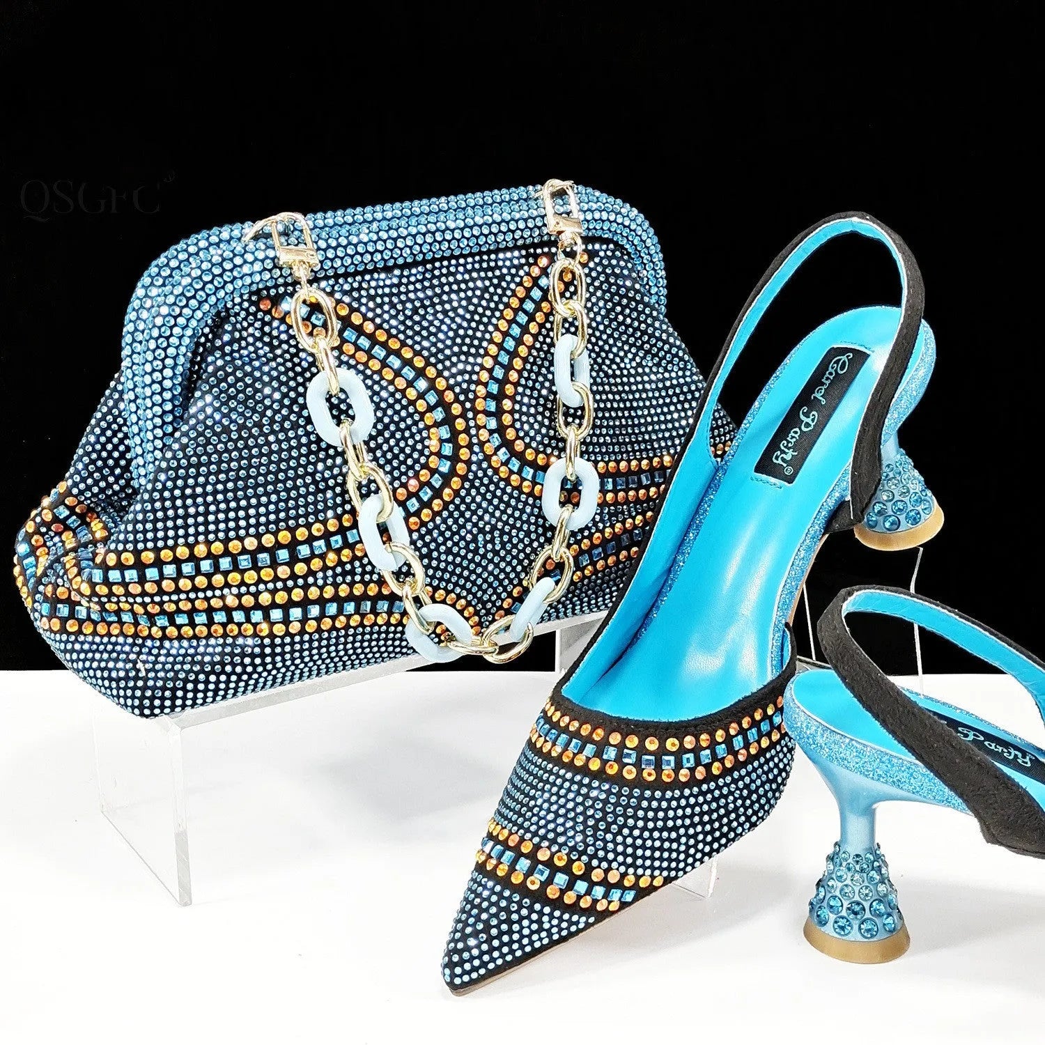 Women's pointed toe high heel shoes with rhinestone decoration and matching small bag in synthetic leather