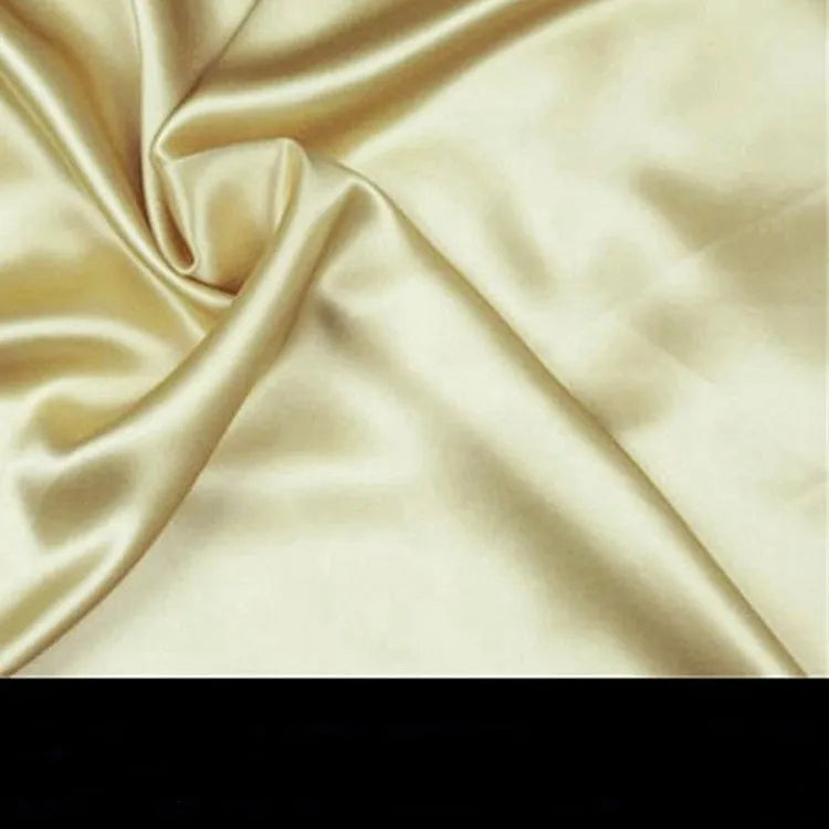 Double-sided silk pillowcase in apricot colour showing smooth satin weave texture.