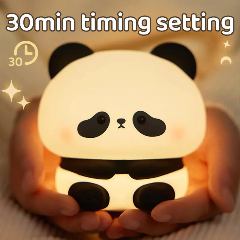 Panda LED night light with soft silicone head and colourful glow on a wooden table