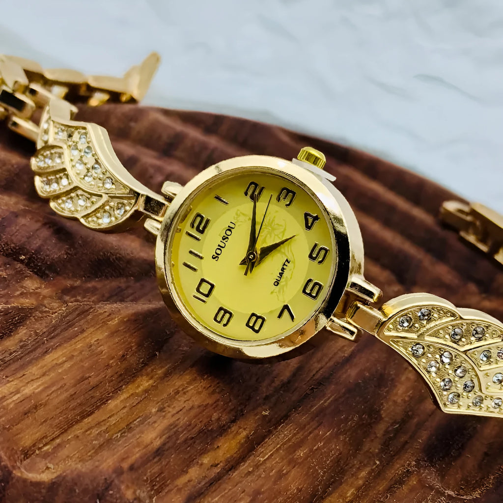 Women's stainless steel watch with round dial on wrist, showing Vachette clasp.