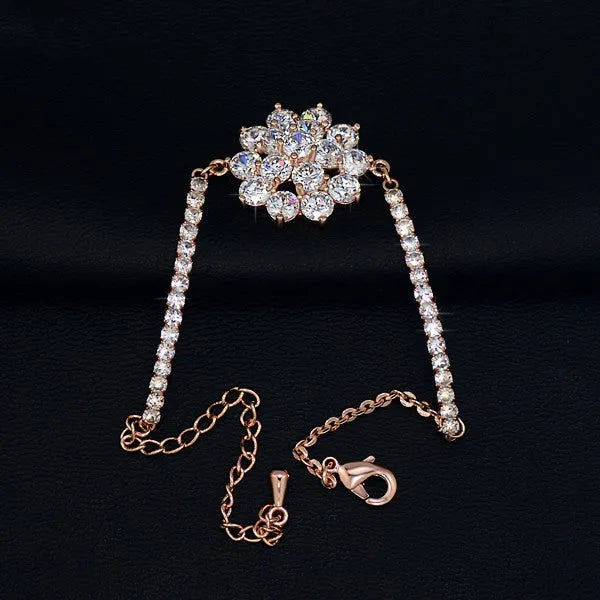 Rose gold cubic zirconia bracelet with cross crown Roman numeral motifs on alloy setting