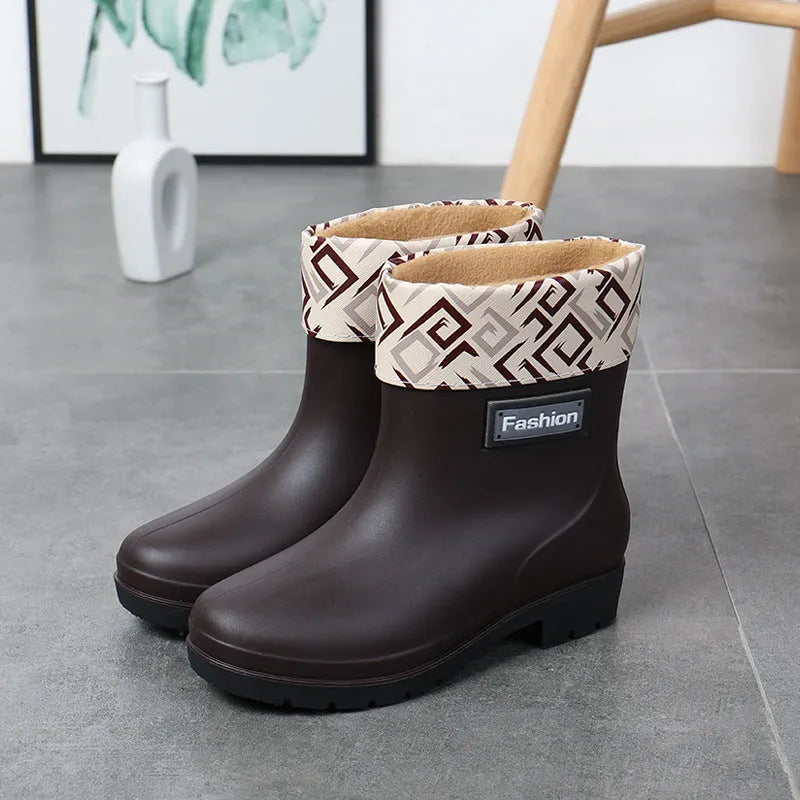 Women's mid-calf PVC rain boots in black with low heel design