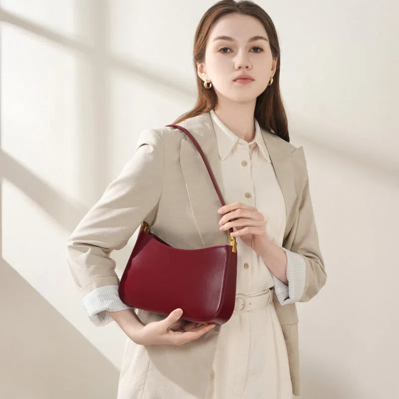 Women's casual French-style oval one-shoulder bag in cowhide leather, 25.5x6x14cm, available in black