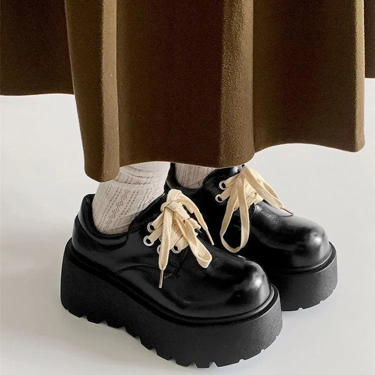 Matte black women's retro lace-up shoes with a chunky block heel and round toe.