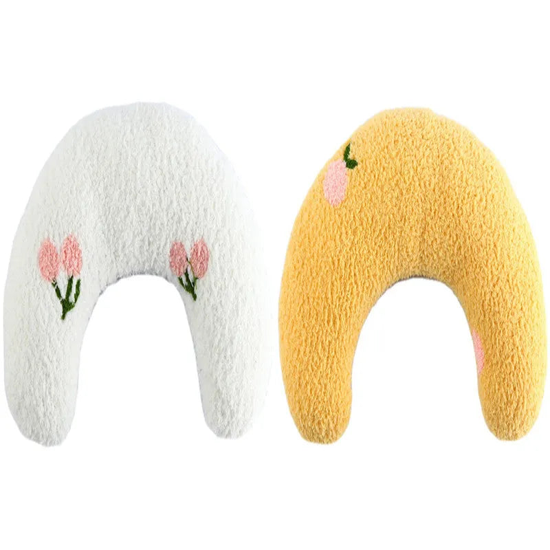 Small half-donut shaped plush pet pillow in blue, showing U-shaped design for cat or small dog neck support.