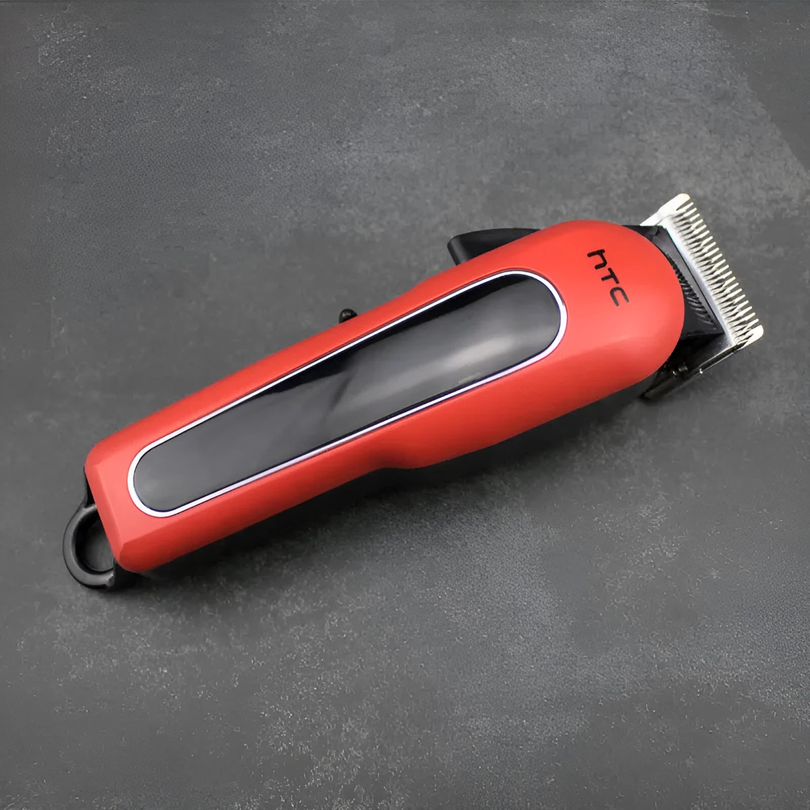 A black wireless hair clipper with four plastic limiting combs placed on a white background.