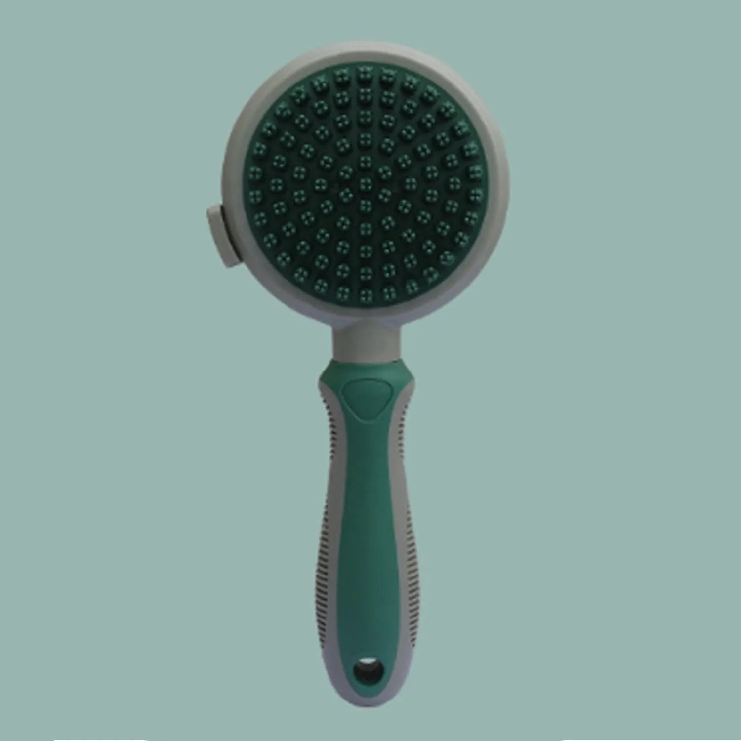 Pink and green double-sided cat grooming brush with flea comb attachment and release button