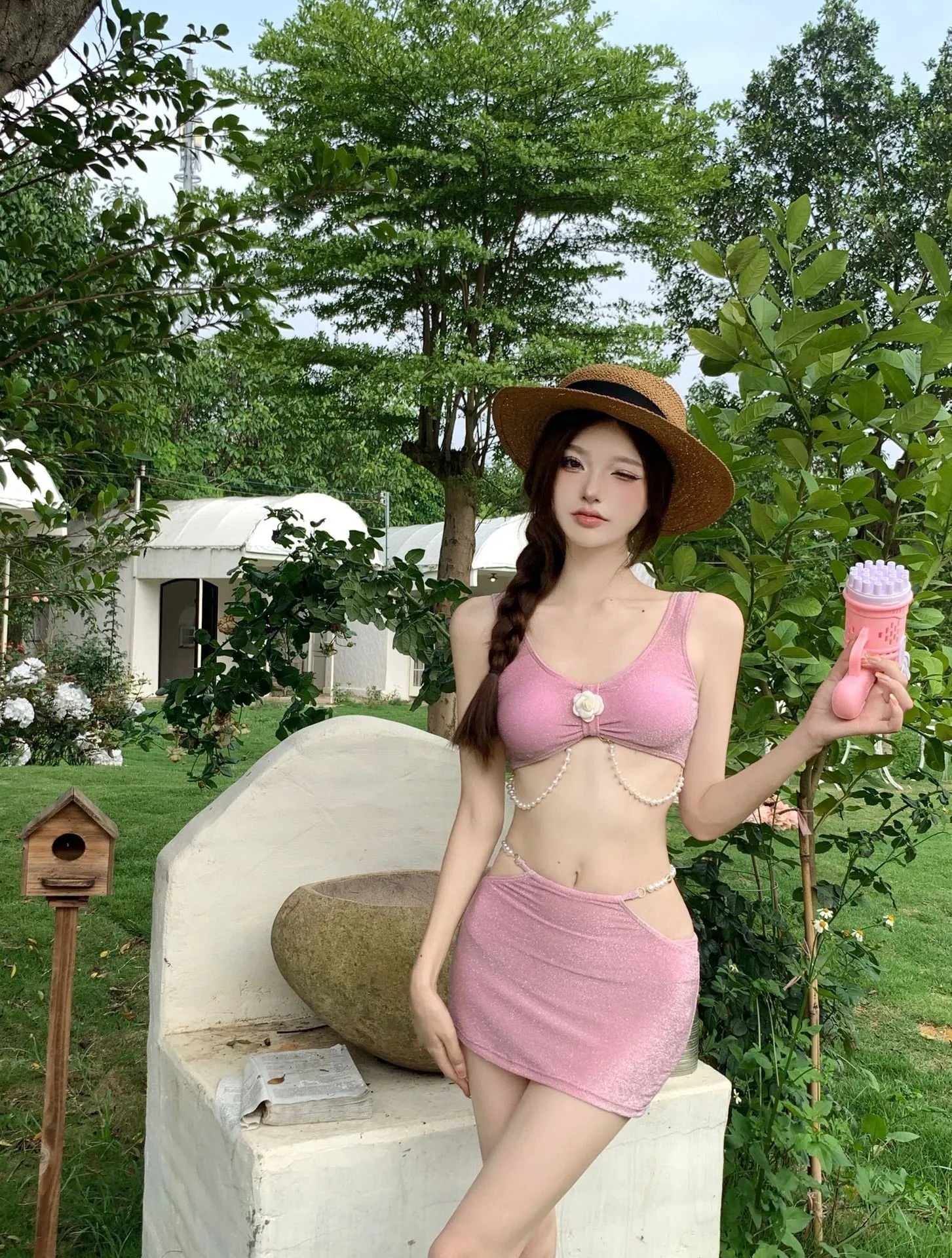 Women's pink and black three-piece bikini swimsuit set with briefs, made from high elasticity polyester fabric.