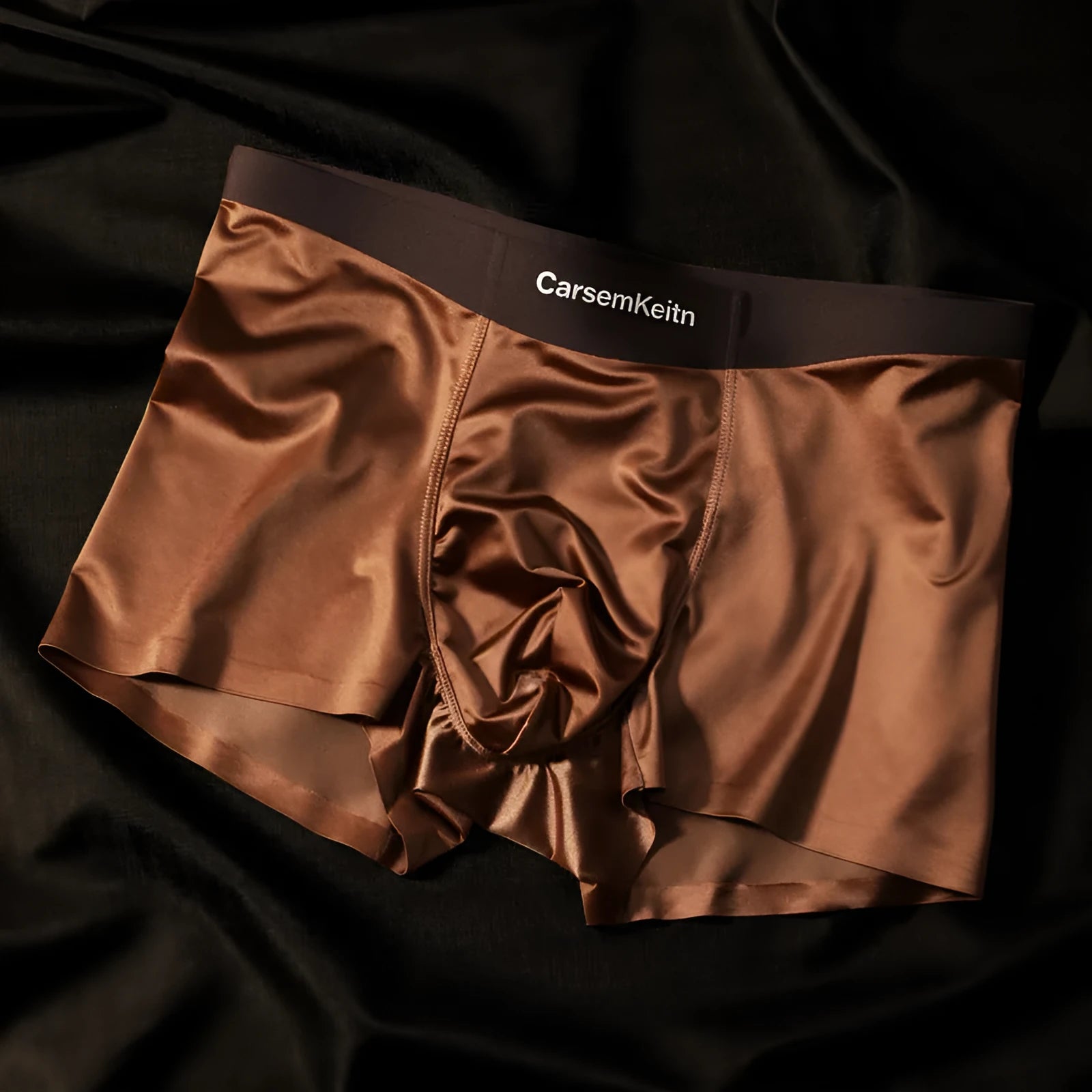Men's solid colour ice silk seamless underwear laid flat, showing its knit construction.