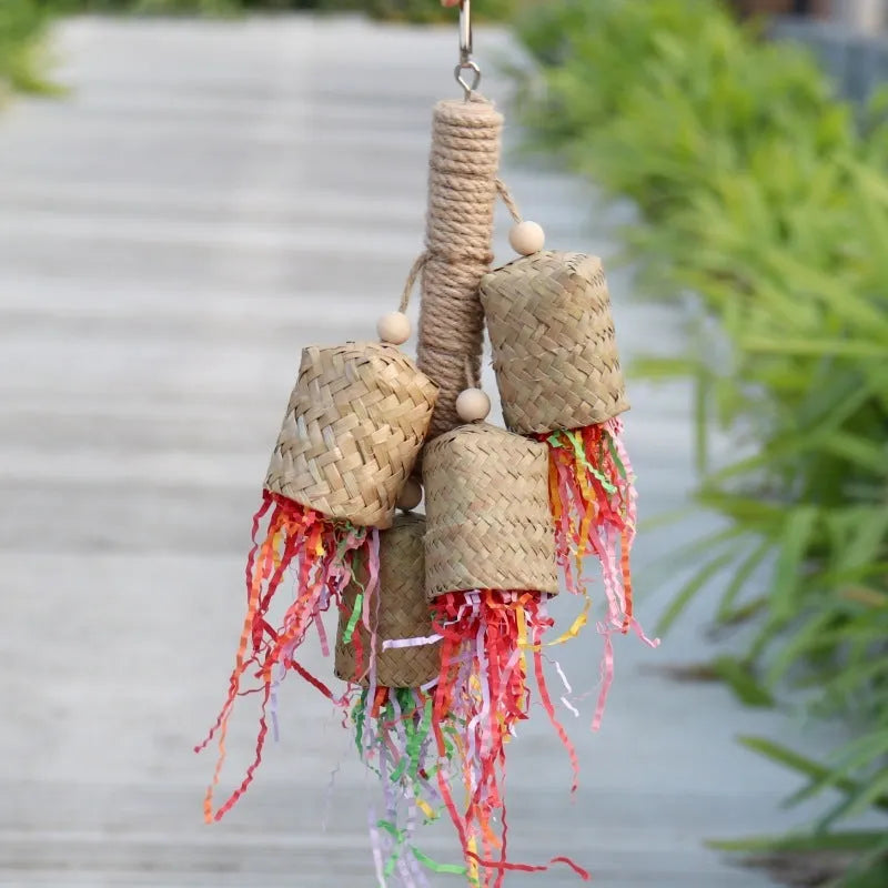 Colourful shredded paper parrot toy with wood and sisal construction measuring 15 by 35 centimetres