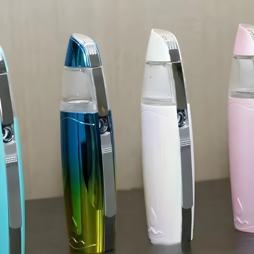 Peacock blue USB rechargeable handheld facial steamer producing water mist