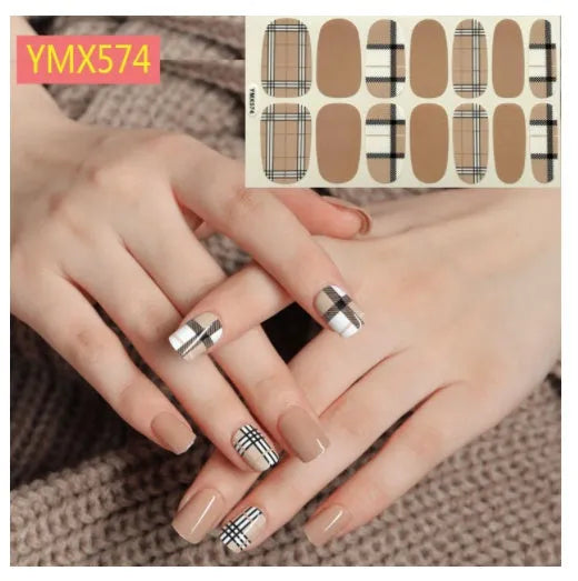 Full nail stickers set of 14 sheets showing 16 colour options in a flat lay arrangement