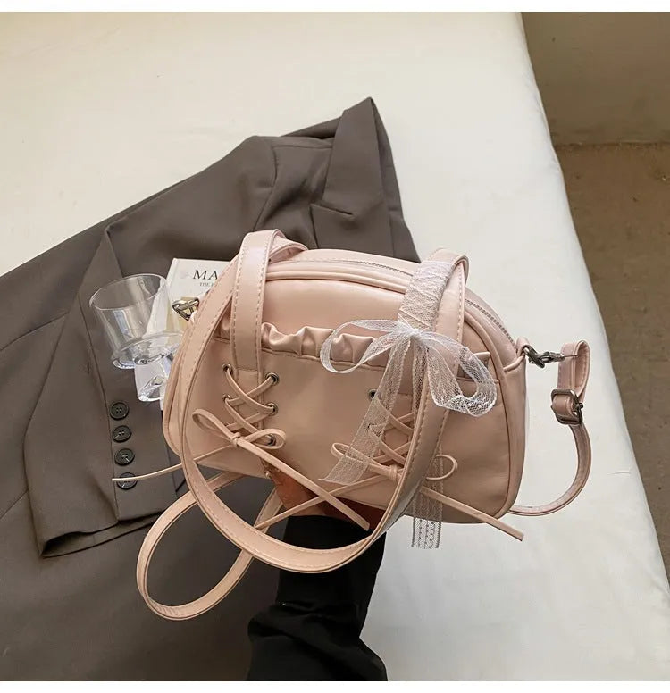 Women's casual PU shoulder handbag with a bandage bow and internal phone pocket in beige, black, blue, or pink.