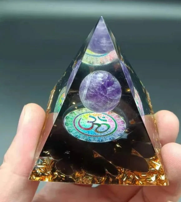 Clear epoxy resin pyramid ornament with embedded blue lapis lazuli crystal gravel, 6cm tall.
