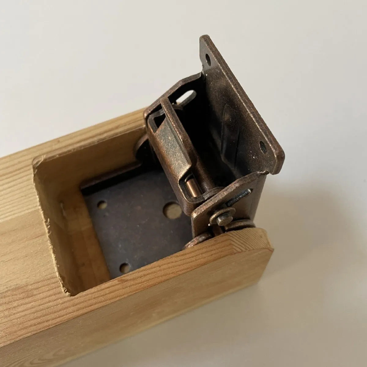 Furniture foot folding hinge with invisible self-locking mechanism in multiple colour finishes