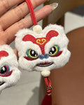 Handmade blue and yellow Chinese style plush lion keychain ornament with star stone decoration.