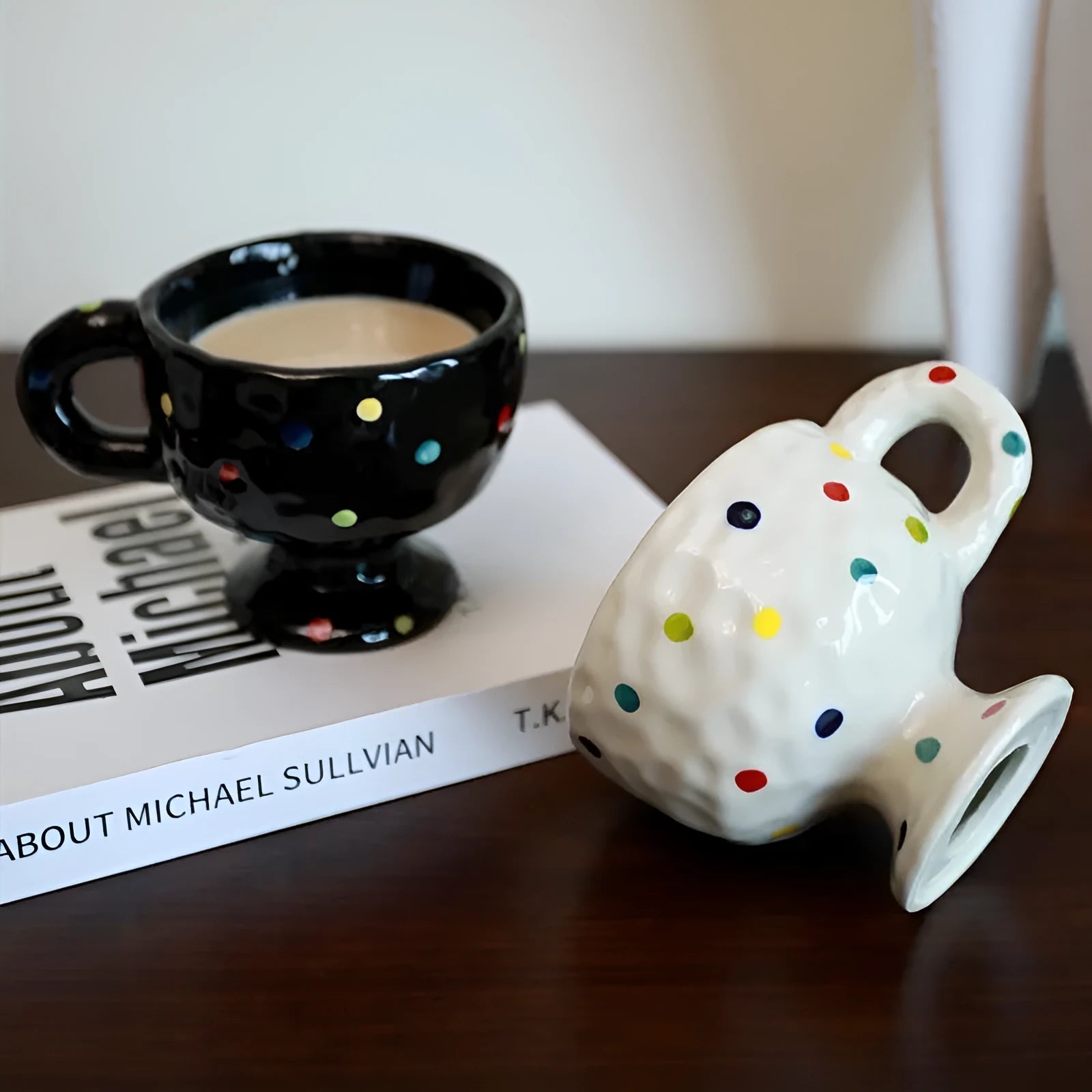 Hand-pinched irregular ceramic mug in solid colour with modern design