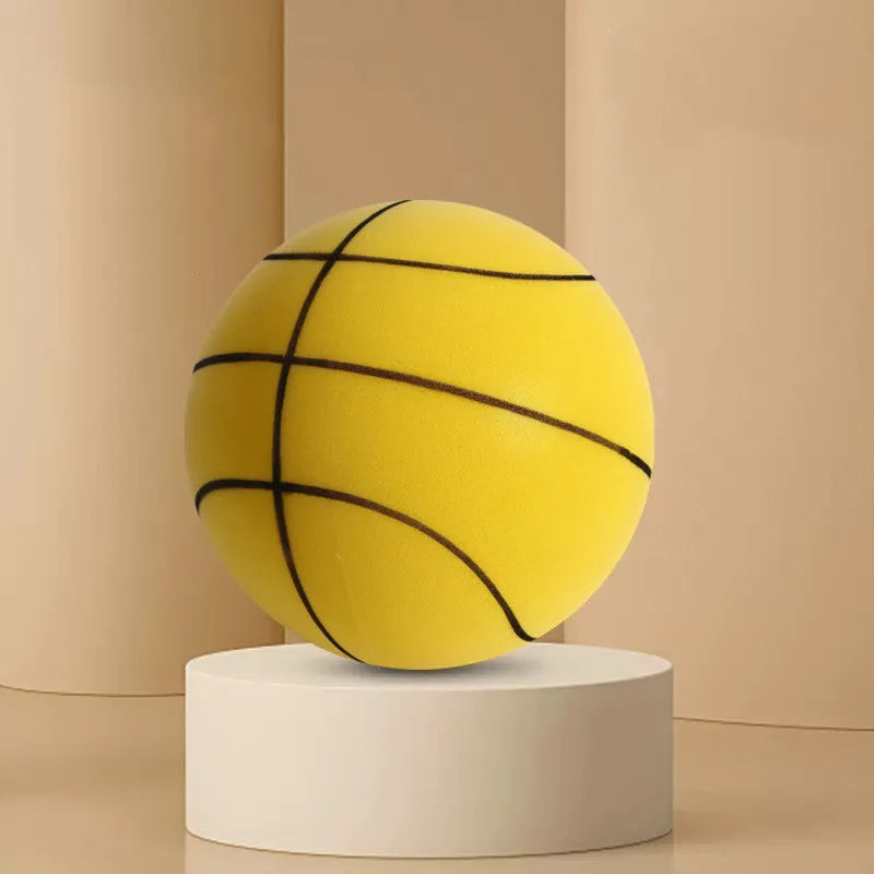 Assortment of bright coloured silent foam basketballs with a basketball frame on a neutral background