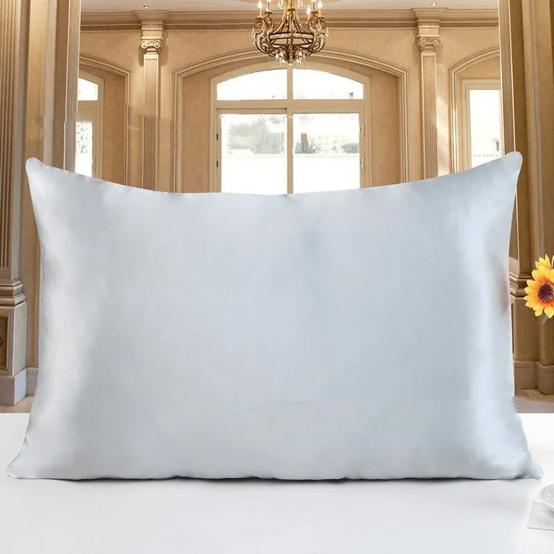 Double-sided silk pillowcase in apricot colour showing smooth satin weave texture.