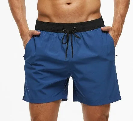 Men's blue running shorts with a stitching waistband, drawstring, and a side zippered pocket.