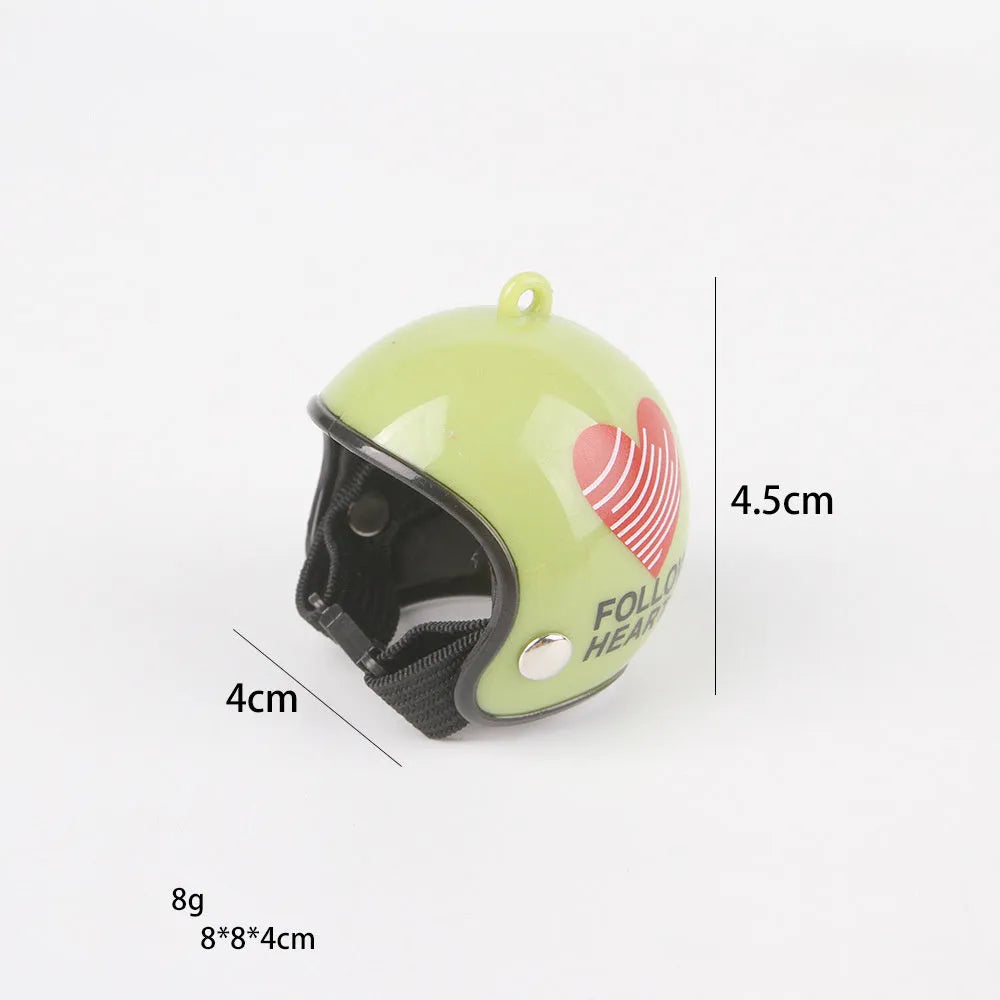 Small adjustable plastic safety helmet for a chicken or bird, shown in a fun design.