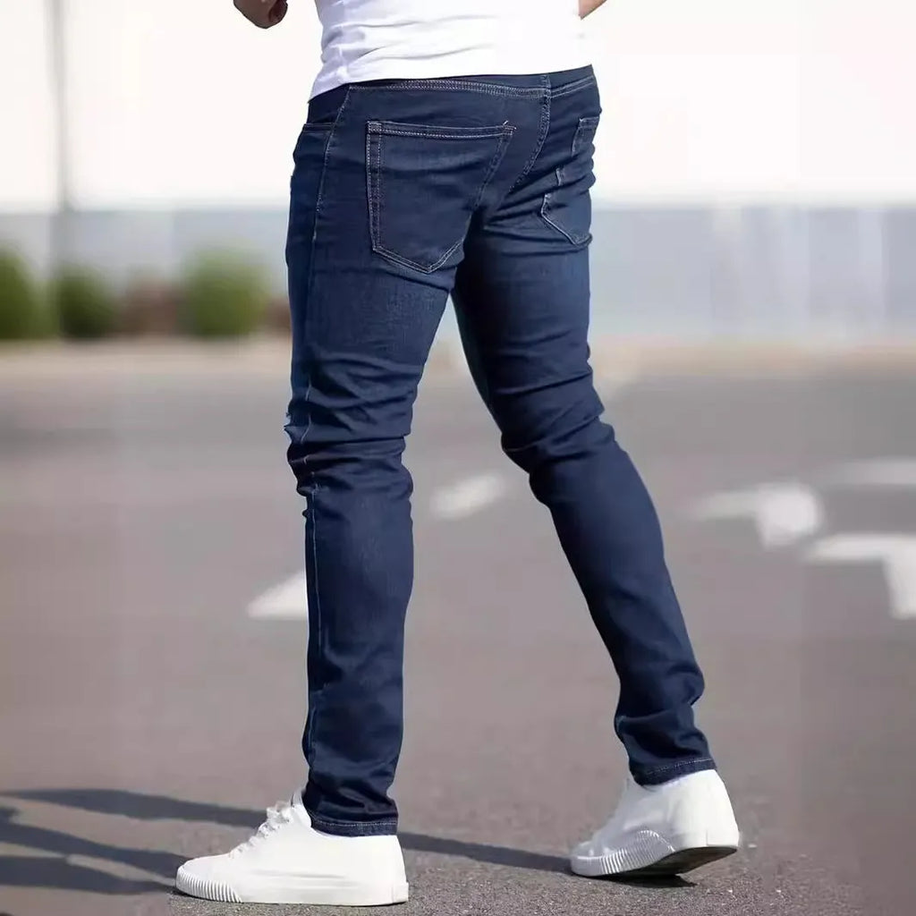 Men's dark blue slim casual jeans with street fashion styling and mid waist design
