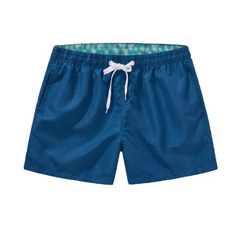 Men's straight leg polyester board shorts on a hanger, available in multiple colours and plus sizes.