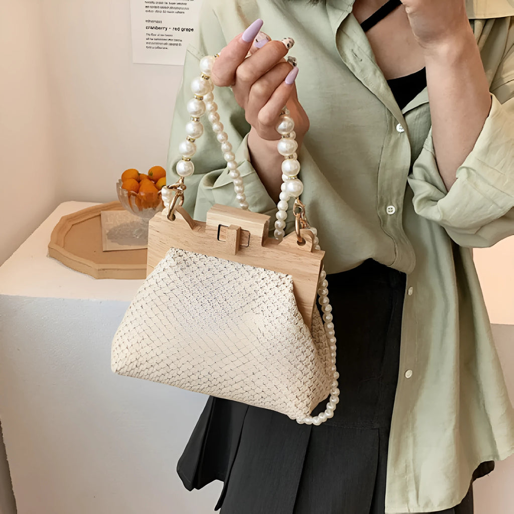 Women's woven straw shoulder bag with pearl chain strap in horizontal square shape
