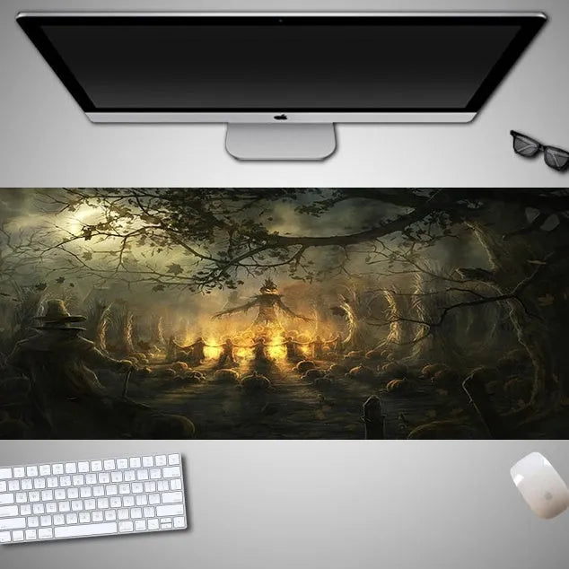 Oversized Halloween graphic cloth mouse pad on a desk, showing non-slip rubber base.