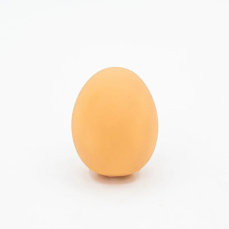 Chicken-flavoured simulation egg dog toy with textured surface for dental cleaning