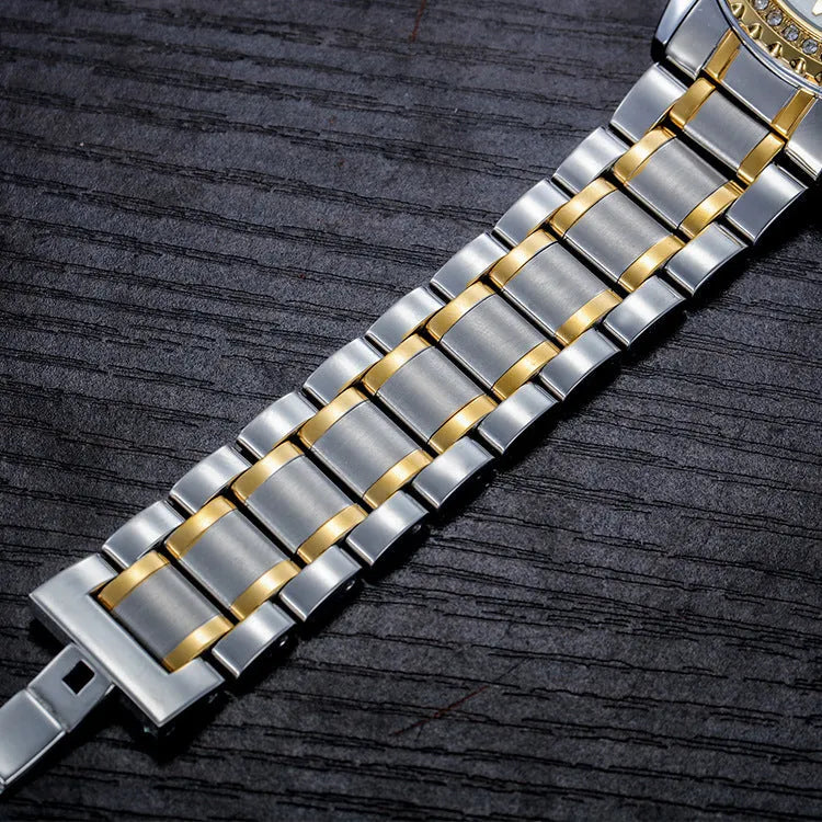 Fashionmonger men's gold and black automatic waterproof watch with luminous hands on a wrist.