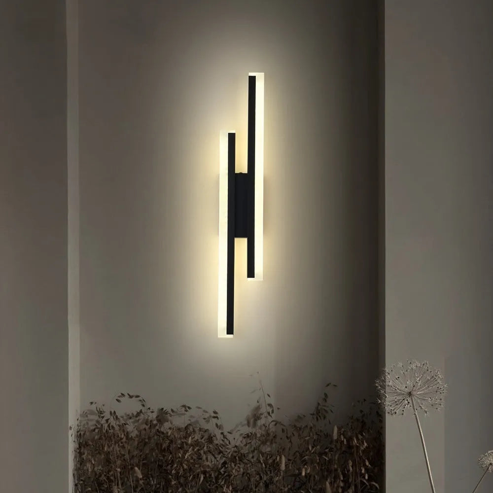 Modern gold double line wall lamp mounted on a wall, showing its 500mm length and artistic design for background lighting.