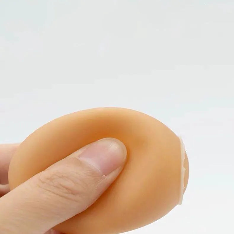 Chicken-flavoured simulation egg dog toy with textured surface for dental cleaning