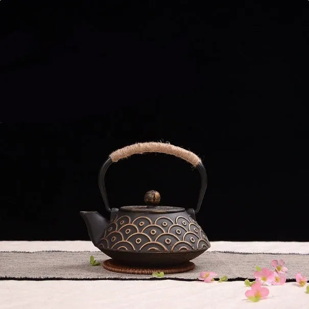 Japanese style cast iron teapot with traditional design and 0.9L capacity for tea brewing