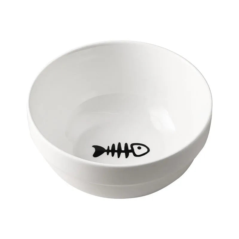 White ceramic cat bowl with cat paw print design on a black iron frame stand