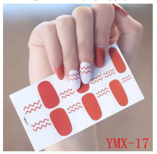Full nail stickers set of 14 sheets showing 16 colour options in a flat lay arrangement