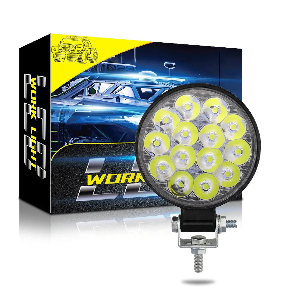 White mini round aluminium LED work light for car, truck, or boat with 42W power and IP67 rating.