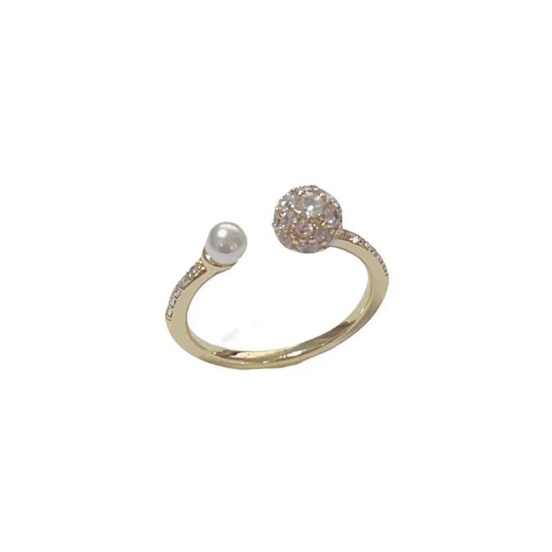 Open-end geometric pearl ring with round zircon accents in gold or silver finish