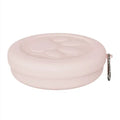 Portable plastic dog bowl with snack compartment and metal carrying clip in light green colour.
