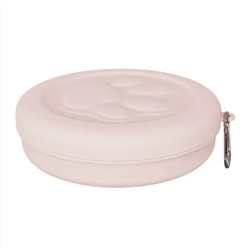 Portable plastic dog bowl with snack compartment and metal carrying clip in light green colour.