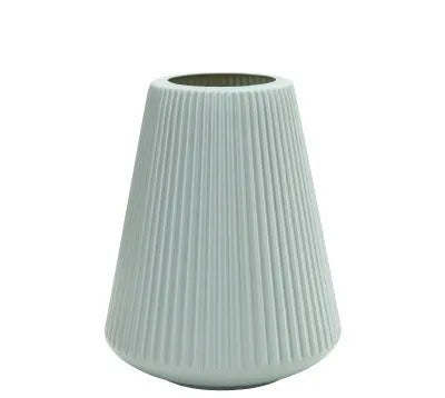 White melamine plastic decorative flower vase measuring 16cm by 20cm on a desktop