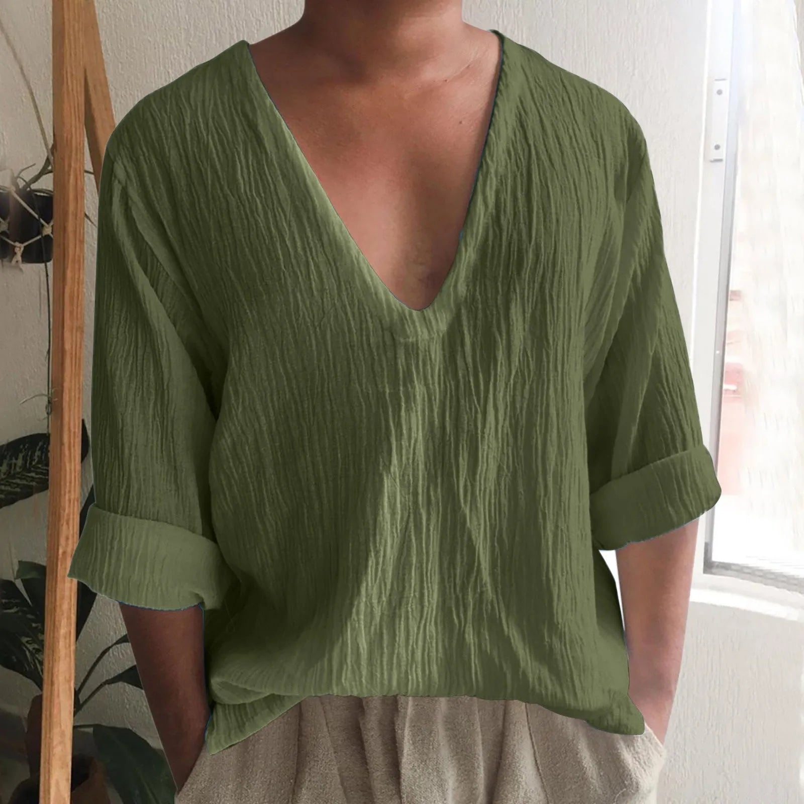 Men's solid colour long sleeve V-neck T-shirt in washed cotton fabric.