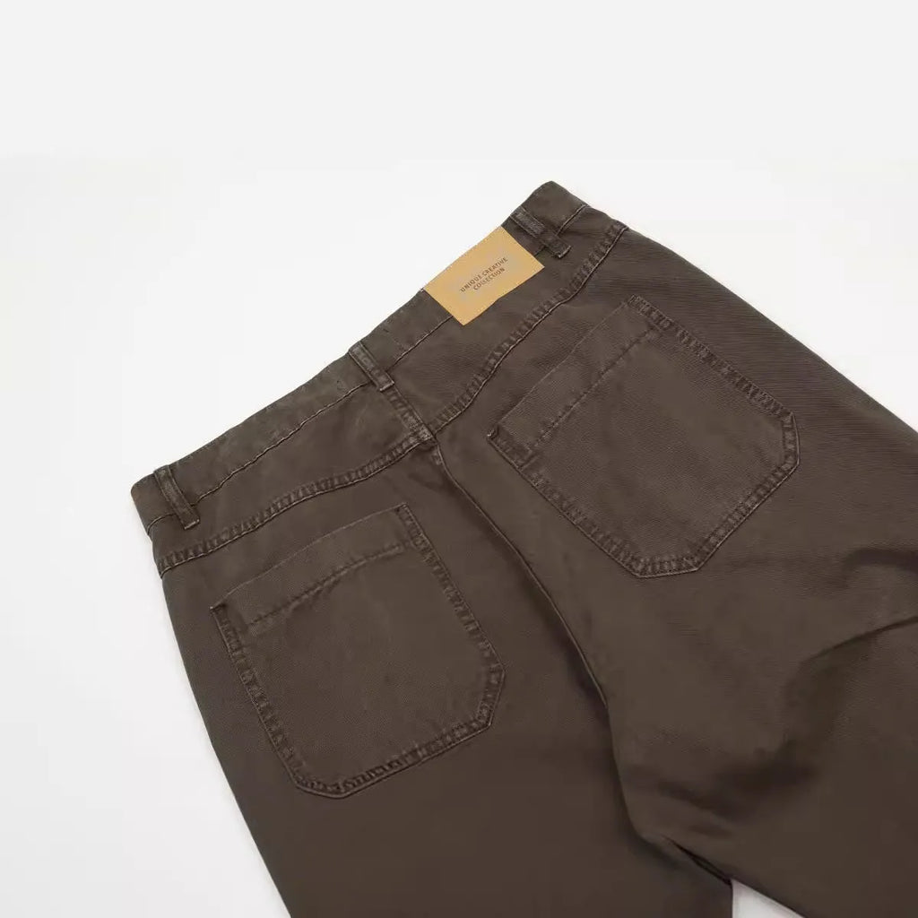 Men's brown loose straight leg trousers with high waist design and zip fly closure
