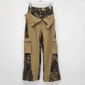 Women's dark khaki leopard print high waist straight leg jeans with contrast stitching detail.