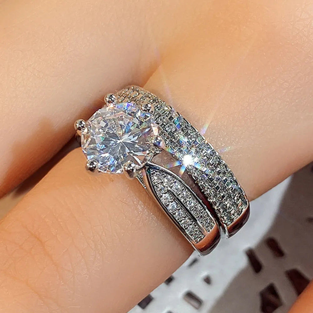 White gold colour wedding ring attached to matching bracelet with geometric shapes and round decorative elements
