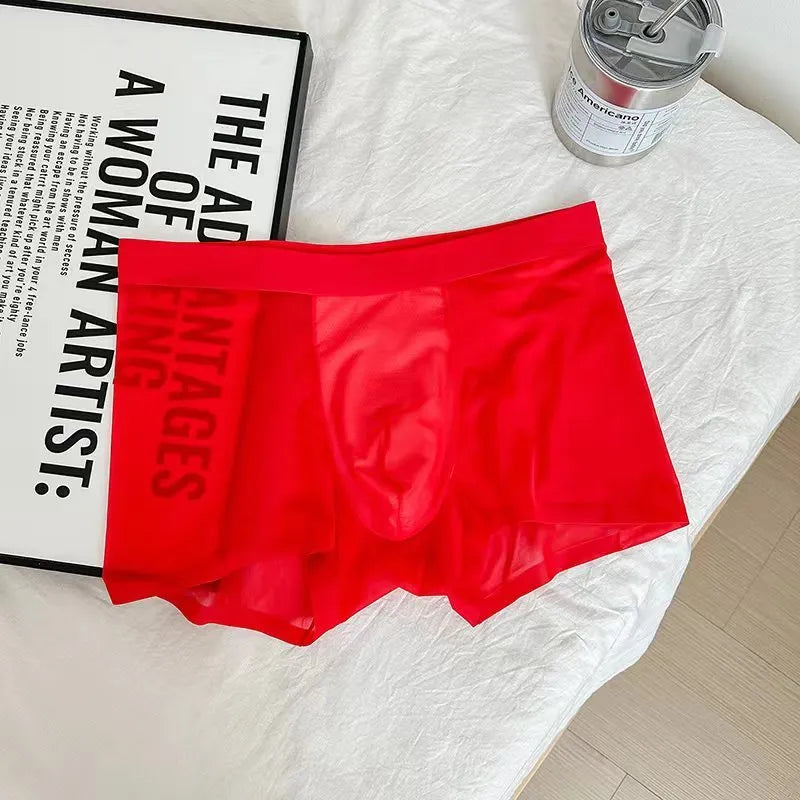 Seamless men's boxer shorts in ultra-thin ice silk nylon fabric, showing honeycomb crotch design.
