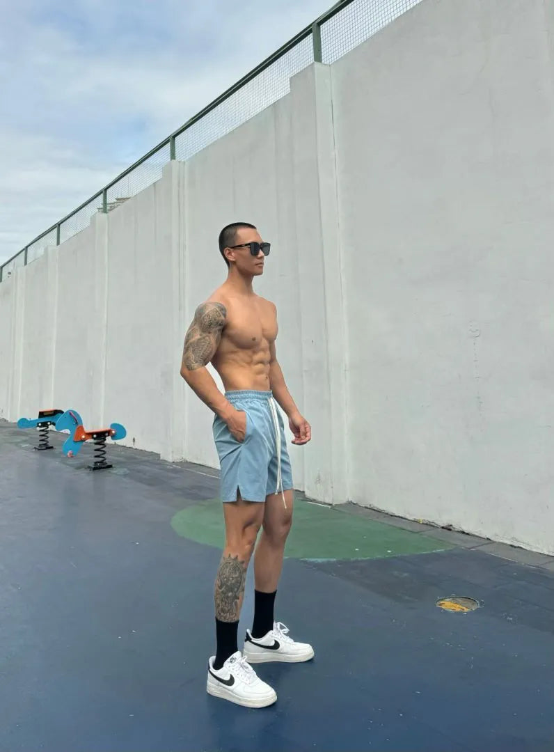 Men's black quick-drying nylon ice silk shorts with double-layer quarter-length design