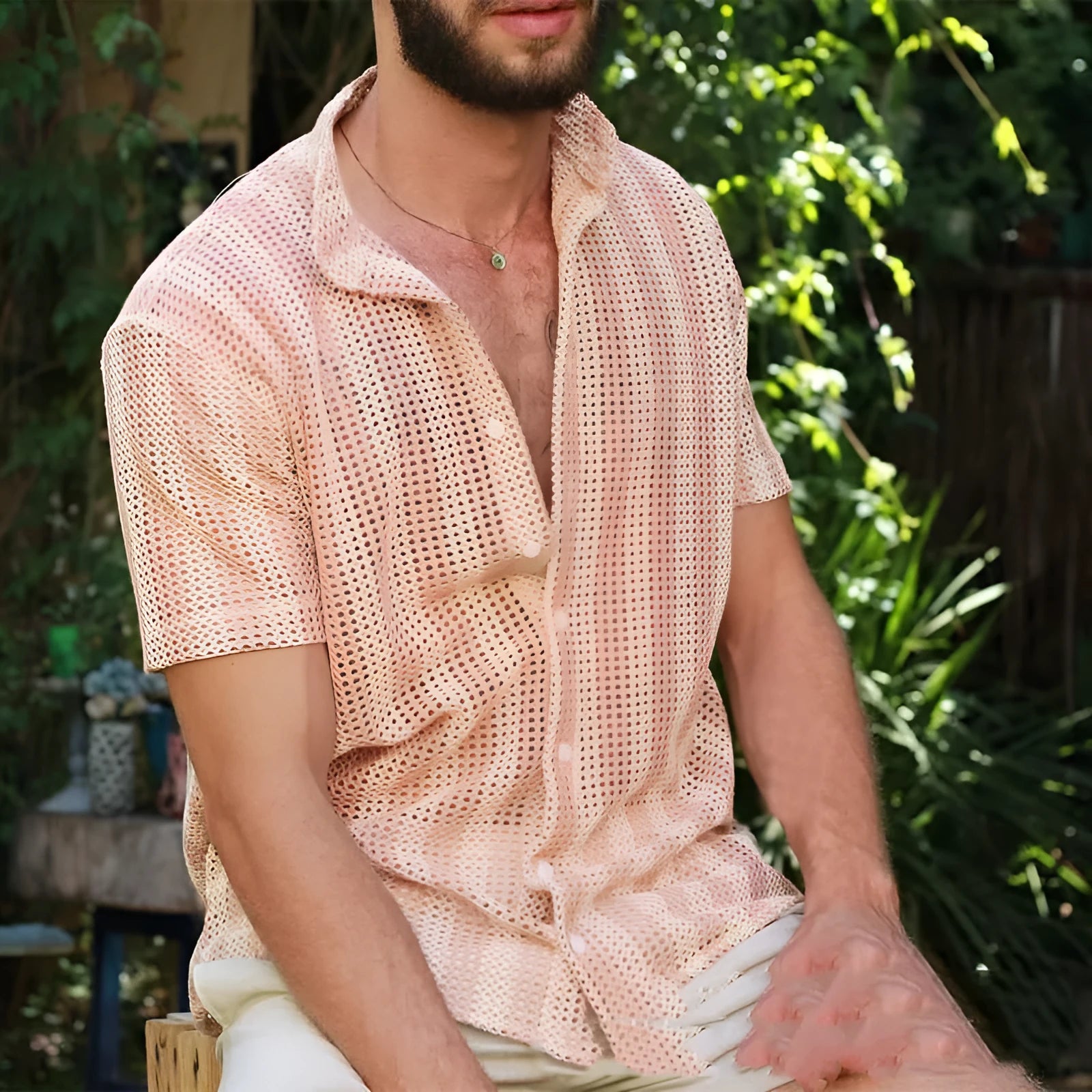 Pink men's loose-fit waffle texture cardigan shirt with short sleeves on a hanger